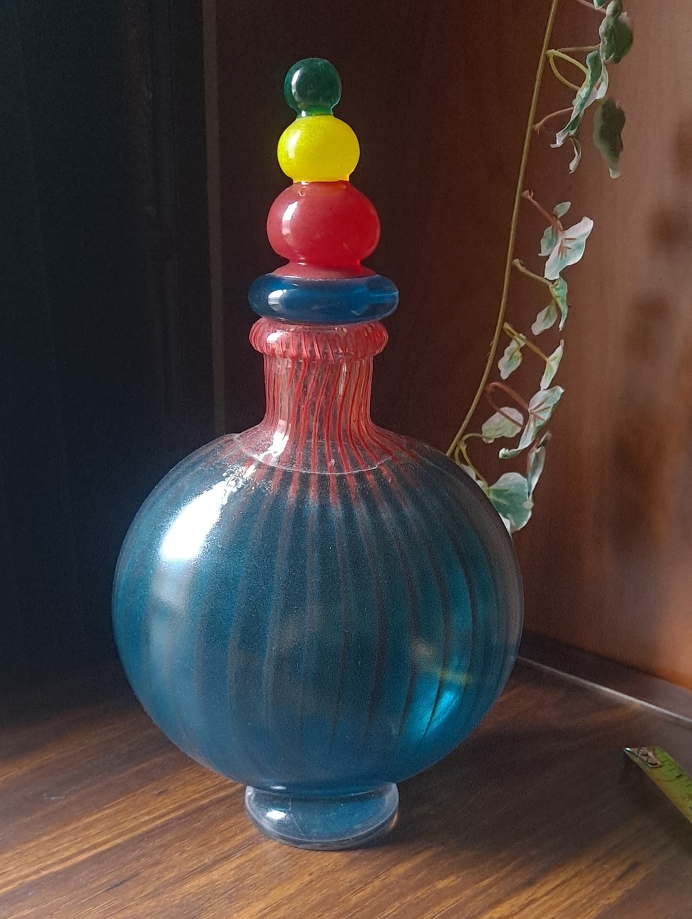 Kosta Boda Blue Glass Bottle with Red, Yellow & Green Stacked Stopper